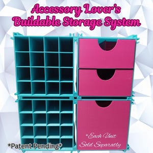 May include: A teal and pink buildable storage system. The system features open cubbies and drawers. Text on the image reads "Accessory Lover's Buildable Storage System", "*Patent Pending*", and "*Each Unit Sold Separately*".