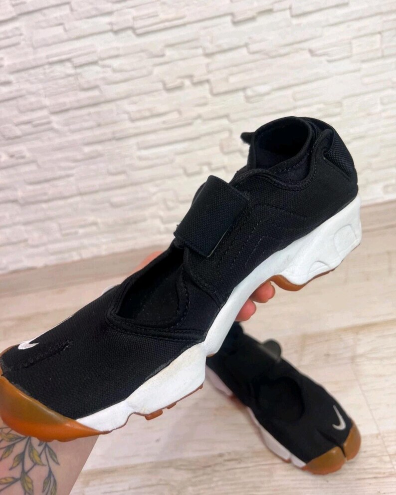 May include: A set of three ceramic mugs with a speckled, matte finish. The mugs are in shades of cream, light gray, and dark gray. Each mug has a simple, minimalist design, perfect for coffee or tea.