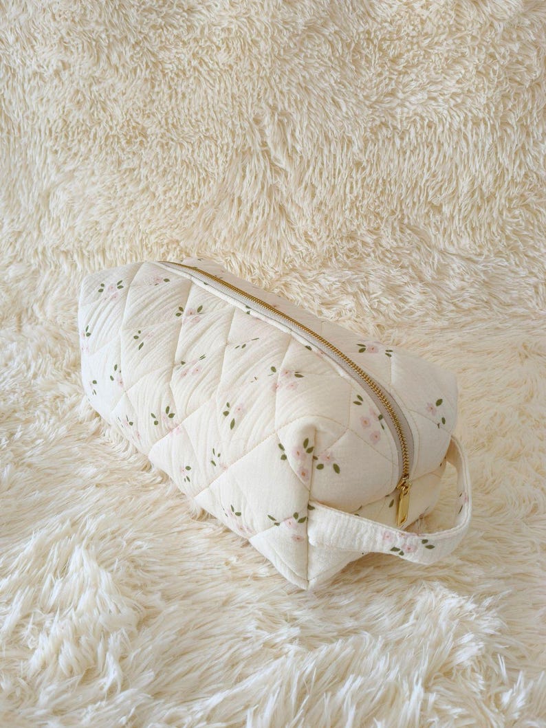 Pink flower on white coquette padded quilted toiletry bag case pouch organizer holder for Dyson Airwrap, Dyson Airstrait, Shark Flexstyle, Shark SmoothStyle, Shark FlexFusion, T3 Aire 360 hair styling tools, 4 interior divider compartment pockets for attachments and accessories, large travel makeup bag, cosmetic case, curling iron storage, hair dryer bag for women, gift for her, vanity organizer, carry-on travel essential