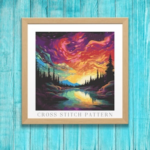 May include: Cross stitch pattern of a colorful sunset over a lake with trees and mountains in the background. The sky is a vibrant mix of pink, orange, yellow, and purple. The lake is a deep blue with reflections of the sky. The trees are dark green and the mountains are a light blue. The pattern is titled "Cross Stitch Pattern".