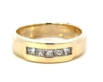 May include: A gold band ring with a row of small, clear, square-shaped diamonds.