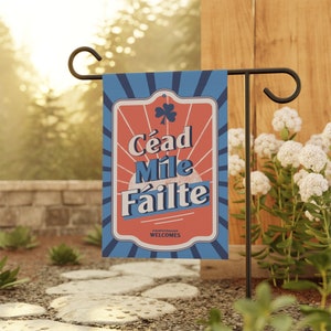 May include: A blue and red garden flag with the Irish phrase "Cead Mile Failte" which means "A Hundred Thousand Welcomes".