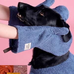 May include: A blue dog grooming mitt and towel set is shown on a black dog against a pink background. The mitt has a tag that says "Billow K9". The image also shows other available colours. Made in Britain.