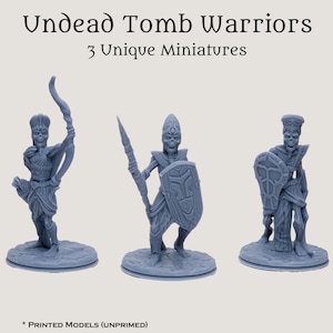 May include: Three gray 3D printed miniature undead tomb warriors. The figures are posed in different stances, one holding a bow and arrow, one holding a spear and shield, and one holding a shield. The figures are standing on round bases.