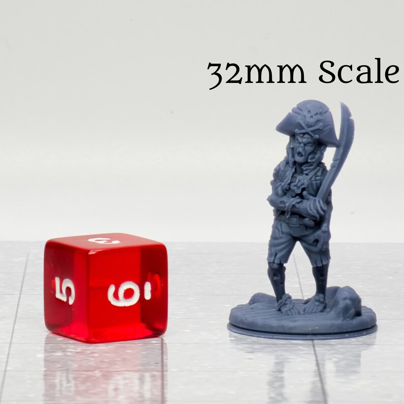 May include: A gray plastic miniature figure of a pirate holding a sword, standing on a round base. The figure is 32mm in scale, as indicated by the text "32mm Scale" above the figure. A red 6-sided die is in the foreground for scale.