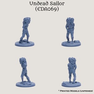 May include: A blue plastic miniature figure of an undead sailor with a pile of skulls on its back. The figure is standing on a round base. The figure is unpainted. The text "Undead Sailor (EDAo69)" is at the top of the image.