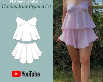 May include: A light pink pajama set with a tiered top and shorts. The top has spaghetti straps and a sweetheart neckline. The image also shows a line drawing of the pajama set and the text "PDF Sewing Pattern The Sandrine Pyjama Set".