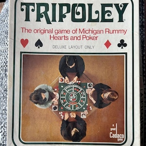 May include: A vintage Tripoley board game box featuring the text Tripoley, The original game of Michigan Rummy Hearts and Poker, and DELUXE LAYOUT ONLY. The cover displays a top-down photograph of four people playing the game on a green mat.