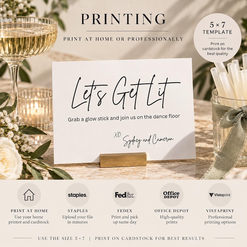 May include: A white 5x7 inch rectangular cardstock sign with black text reading Let's Get Lit, Grab a glow stick and join us on the dance floor, and XO Sydney and Cameron. The sign is held by a gold metal stand on a surface with a glass and glow sticks.
