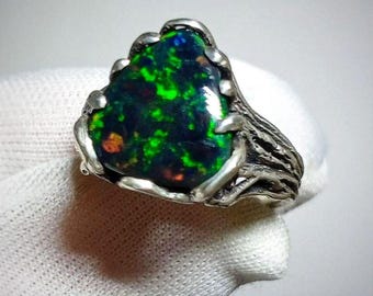 An exquisite mystical jewelry ring with a natural black Ethiopian opal &quot;Constellation of Snakes&quot;