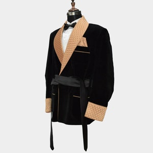 May include: A black velvet robe with a brown quilted collar and cuffs. The robe has a black satin sash.
