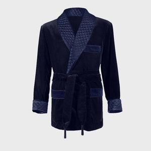 May include: A navy blue velvet robe with a quilted satin collar and cuffs. The robe has a self-tie belt and two pockets.
