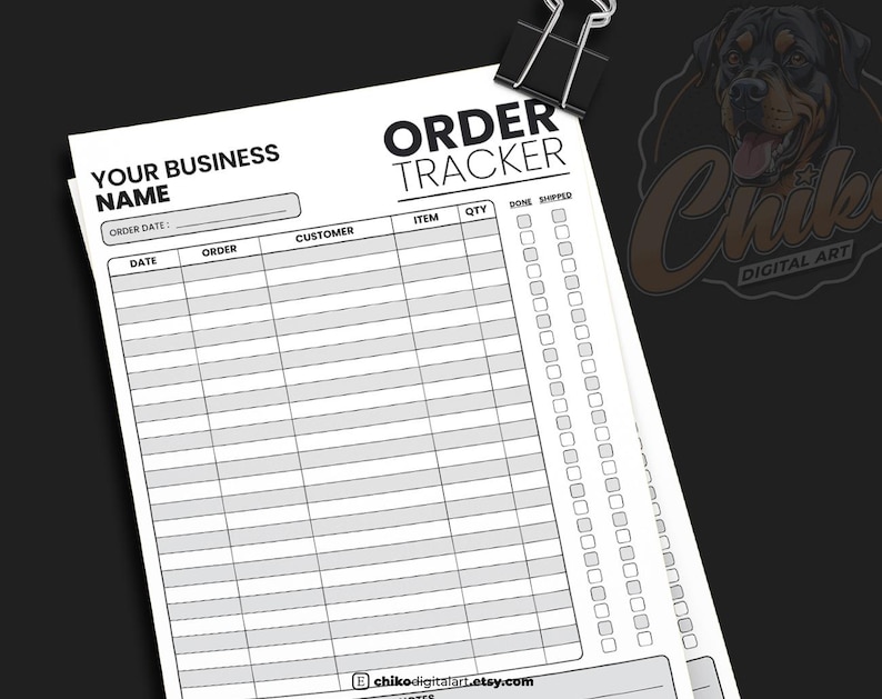 May include: A black and white order tracker sheet with the text "ORDER TRACKER" and spaces for order details. The sheet is held together with a black binder clip. The sheet includes fields for date, order, customer, item, quantity, and shipping status.