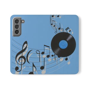 Puede incluir: Una funda de teléfono azul con un disco de vinilo negro y notas musicales.