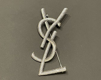 Spilla vintage in metallo argentato Yves Saint Laurent