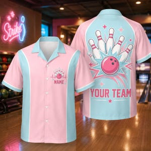 May include: A short-sleeved button-down shirt in light pink and light blue with a bowling theme. The front features a small bowling pin and ball graphic with the text NAME. The back displays a large bowling graphic with the text YOUR TEAM.