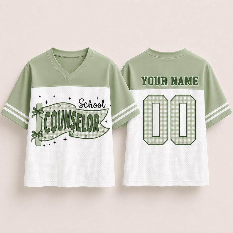 May include: A sage green and white V-neck jersey with short sleeves featuring two white stripes. The front displays a banner graphic with the text School COUNSELOR. The back shows the text YOUR NAME above the double-digit number 00 in a gingham pattern.