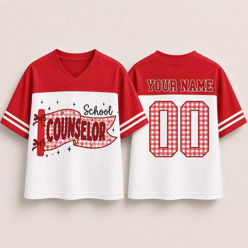 May include: A red and white V-neck jersey with short sleeves and two white stripes on each sleeve. The front features a red gingham banner with the text School COUNSELOR. The back displays the text YOUR NAME above the large red gingham numbers 00.