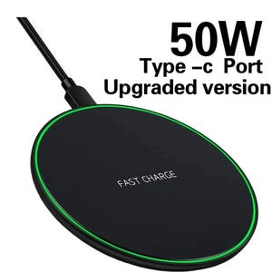 May include: A black wireless charging pad with a green LED ring around the edge. The pad has the text "FAST CHARGE" printed on it. The text "50W Type-C Port Upgraded version" is printed above the pad.