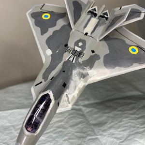paper model of an airplane, an F-22 Raptor fighter