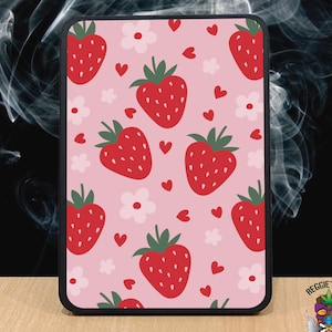 May include: A black phone case with a pink background and a repeating pattern of red strawberries, white flowers, and pink hearts.