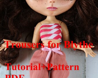 May include: A pink and red striped top and pink pants with a pink ribbon for a Blythe doll. The image includes the text "Trousers for Blythe Tutorial + Pattern PDF".