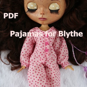 May include: PDF pattern for pajamas for a Blythe doll. The pajamas are pink with a white floral print and have pink buttons.