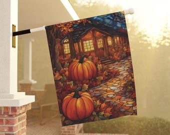 May include: A fall-themed house flag with a stained glass design. The flag features a small house with a porch, surrounded by pumpkins and autumn leaves. The house has a warm glow coming from the windows, and the path leading to the house is made of stone.
