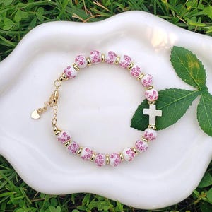 Pink Floral Beaded Cross Bracelet: 18k Gold Seashell Charm
