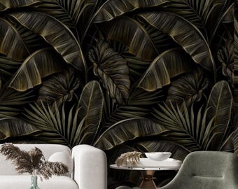 May include: Dark, detailed wallpaper featuring a repeating pattern of large, stylized tropical leaves in shades of olive green and gold against a black background. The leaves have intricate vein details, creating a lush, textured appearance. The wallpaper adds a touch of nature to any room.
