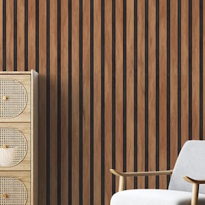May include: A wooden accent wall with vertical, evenly spaced, brown wood panels and dark gray gaps. A light wood cabinet with woven circular doors and a gray armchair are in the image.