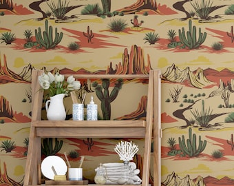 May include: A wooden ladder shelf displays bathroom accessories against a desert landscape wallpaper. The wallpaper features a repeating pattern of cacti, mesas, and a winding river in shades of green, orange, and yellow.