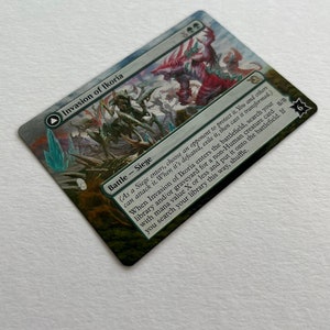 May include: A Magic: The Gathering card called "Invasion of Ikoria" with a green, blue, and red color scheme. The card features a large, multi-headed creature with a red, green, and blue color scheme. The card text reads: "(As a Siege enters, choose an opponent to protect it. You and others can attack it. When it's defeated, exile it, then cast it transformed.) When Invasion of Ikoria enters the battlefield, search your library and/or graveyard for a non-Human creature card with mana value X or less and put it onto the battlefield. If you search your library this way, shuffle."