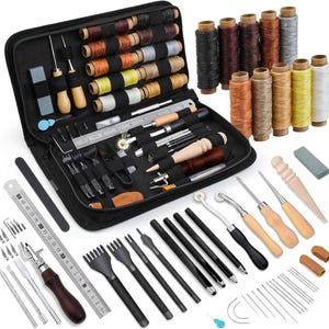 May include: A black leather case with a variety of leather crafting tools, including awls, needles, thread, and a ruler. The case is open and the tools are visible.