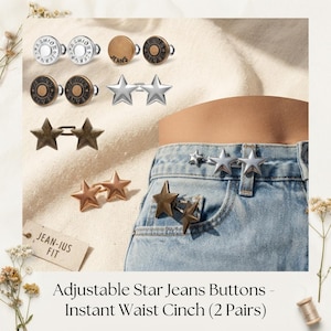 May include: A collection of adjustable jeans buttons including silver, bronze, and copper-toned circular buttons with JEANS text and star-shaped buttons. The buttons are shown attached to the waistband of light blue denim jeans as a waist cinch.