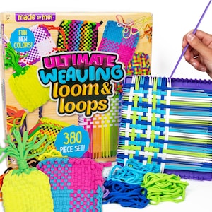 May include: A colorful Ultimate Weaving Loom & Loops set. The box features woven projects in various colors, with the text "FUN NEW COLORS!" and "380 PIECE SET!". A hand holds a purple weaving tool, demonstrating the craft.