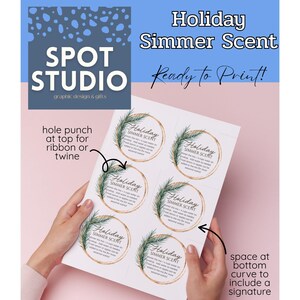 May include: Printable tags with the text "Holiday Simmer Scent" and instructions. The circular tags feature a green and gold wreath design. The image also includes the Spot Studio logo and printing instructions.