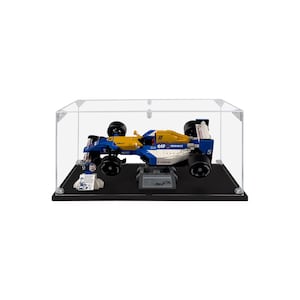 May include: A blue, yellow, and white race car model inside a clear display case. The model has the words "ELF Renault" and "Canon" printed on it. The case sits on a black base.