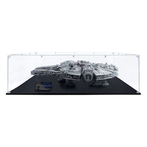 May include: A clear acrylic display case with a black base, showcasing a detailed LEGO Millennium Falcon model.