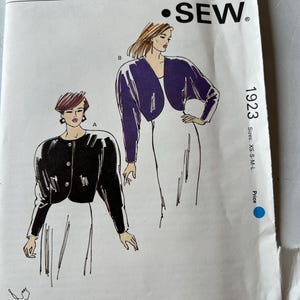 May include: A vintage sewing pattern from Kwik Sew, pattern 1923, featuring illustrations of two jacket designs. The pattern includes sizes XS-S-M-L. The design is by Kerstin Martensson. The pattern is from Kwik Sew Pattern Co., Inc.