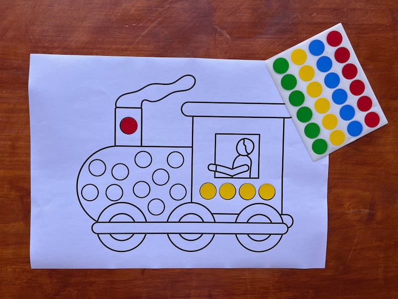 May include: A black and white outline of a train with a red circle on the top of the engine. There are 18 circles on the side of the train, 4 circles in the window, and 4 circles on the back of the train. There are 27 colorful stickers on a white sheet of paper.