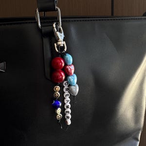 Llavero de cuentas Dreamer, dije colorido para bolso con corazones, cuentas de mal de ojo y emoticono, accesorio para bolso, dije para mochila, regalo para ella