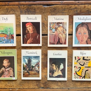 May include: A set of eight vintage art cards featuring famous artists such as Dufy, Botticelli, Matisse, Modigliani, Velazquez, Vlaminck, Courbet, and Klee. Each card features a different painting by the artist and includes the artist's name and the title of the painting.