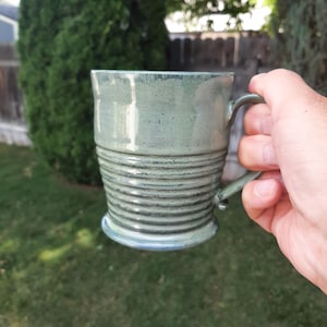 Handmade sage green ceramic coffee mug.
