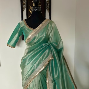 Banarasi  tissue saree with self weaving with beautifully embroidered boarder all over the saree Pestal   shade rich weaving ready Blouse