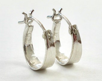 Mini hand-forged hoops in sterling silver