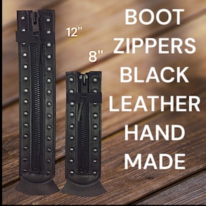 May include: Two black leather boot zippers, one 12 inches long and the other 8 inches long.  The zippers are handmade and have a black zipper pull.