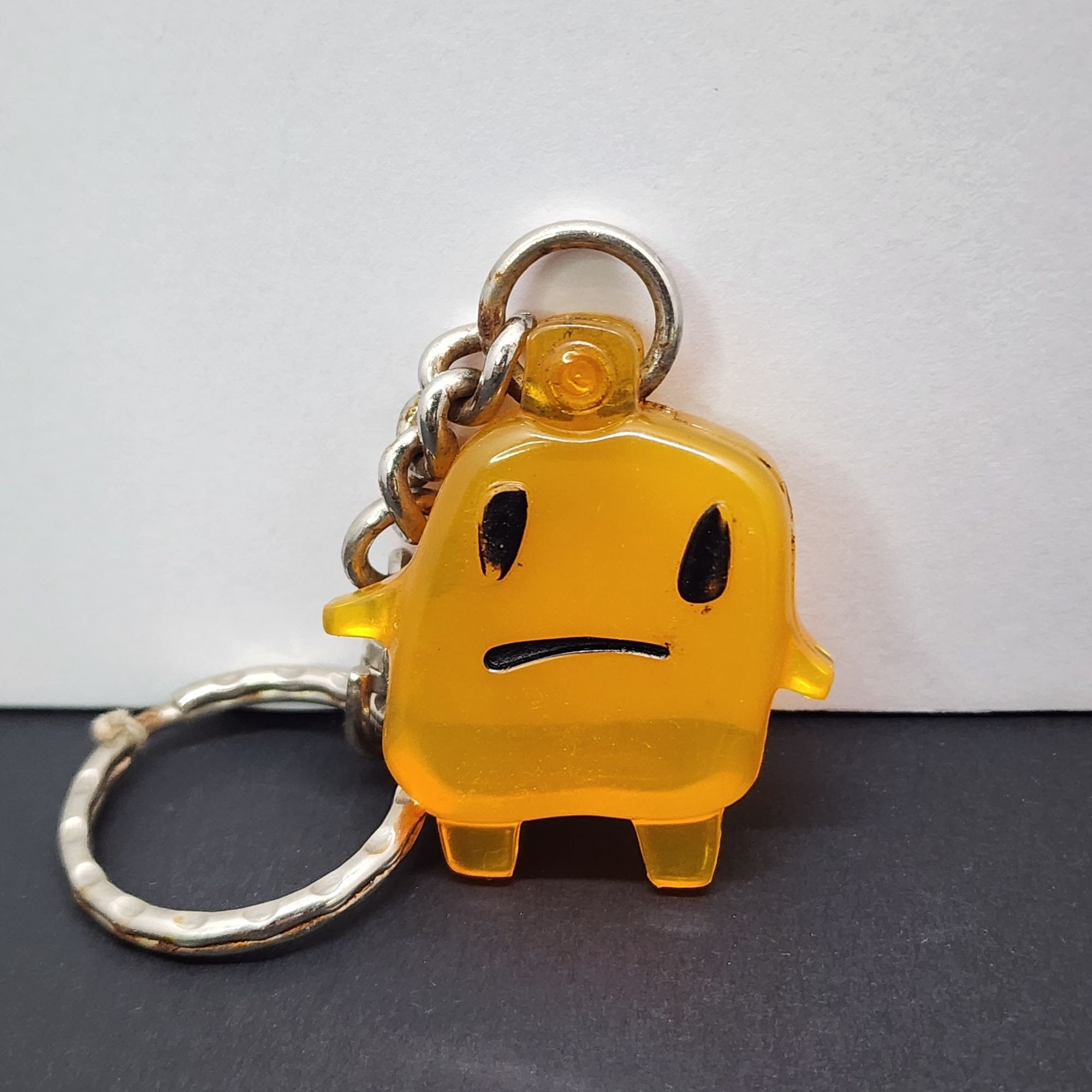1997 Tamagotchi Yellow Sad Face Keychain Mcdonald's Happy Meal