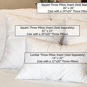May include: Four white throw pillow inserts of different sizes. The largest insert is 26 inches by 26 inches, the next largest is 22 inches by 22 inches, and the smallest is 14 inches by 22 inches. The text on the labels reads "Square Throw Pillow Insert (Sold Separately)" and "Lumbar Throw Pillow Insert (Sold Separately)".