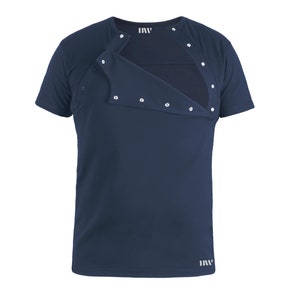 May include: A navy blue short-sleeved t-shirt with a hidden opening for discreet breastfeeding. The shirt has a flap that opens with snaps.